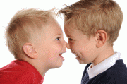 2 boys nose to nose